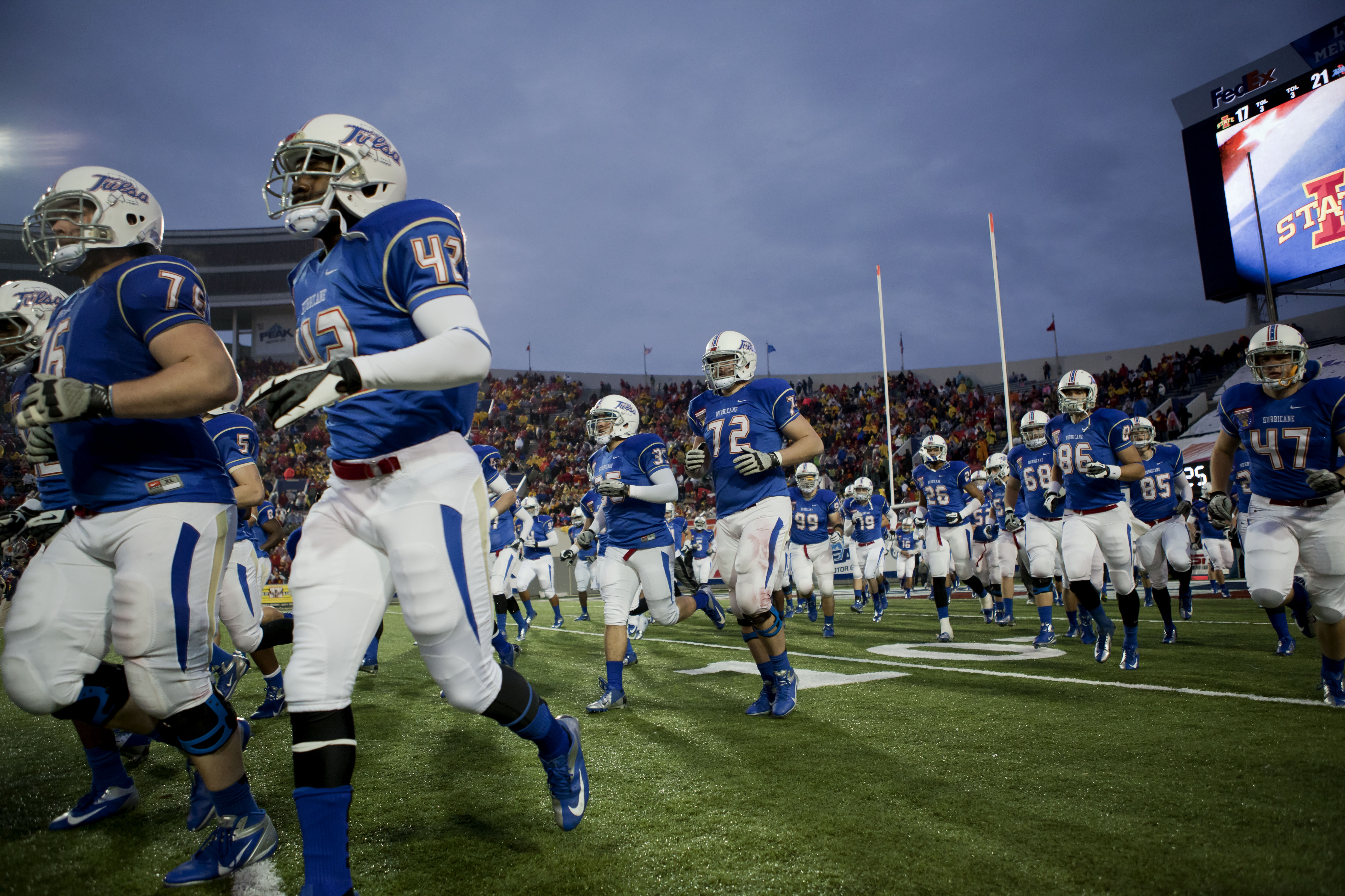 University of Tulsa Football Players run onto the field for the second